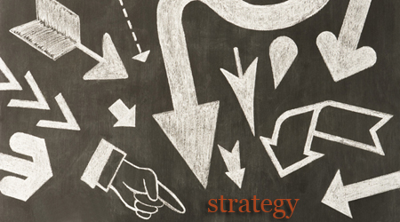 Hand drawn chalk arrows on blackboard